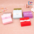 caja de papel rígido de lujo para cajas de embalaje de joyería con cinta de lazo